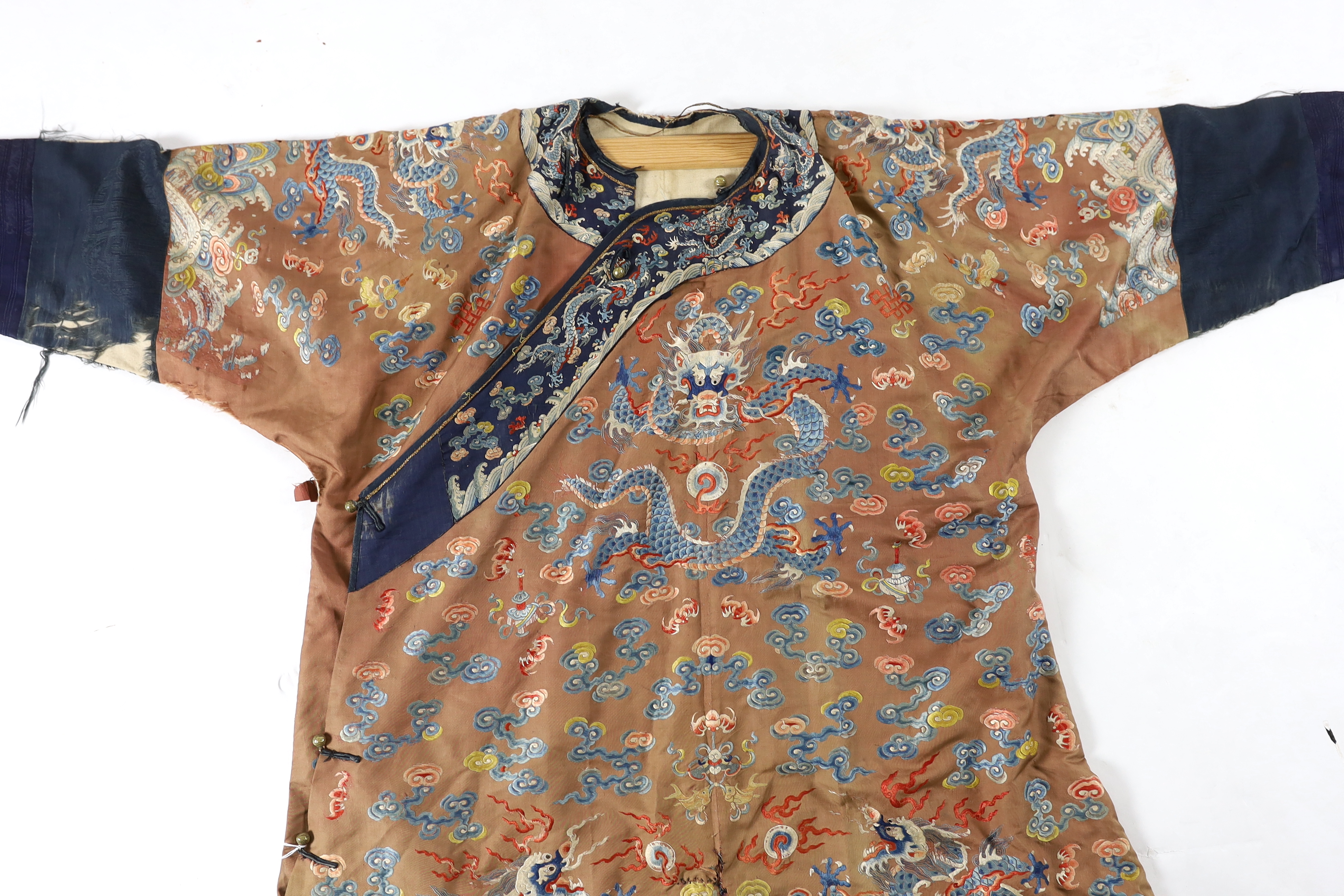 A Chinese chestnut-ground ‘nine dragon’ robe, jifu, 19th century, tears and losses